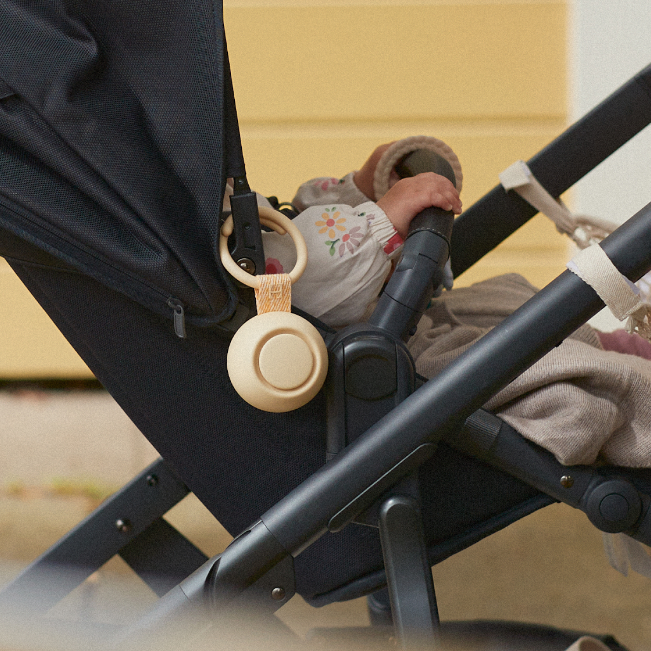 Hatch rest go in honey hanging on a stroller with a baby inside