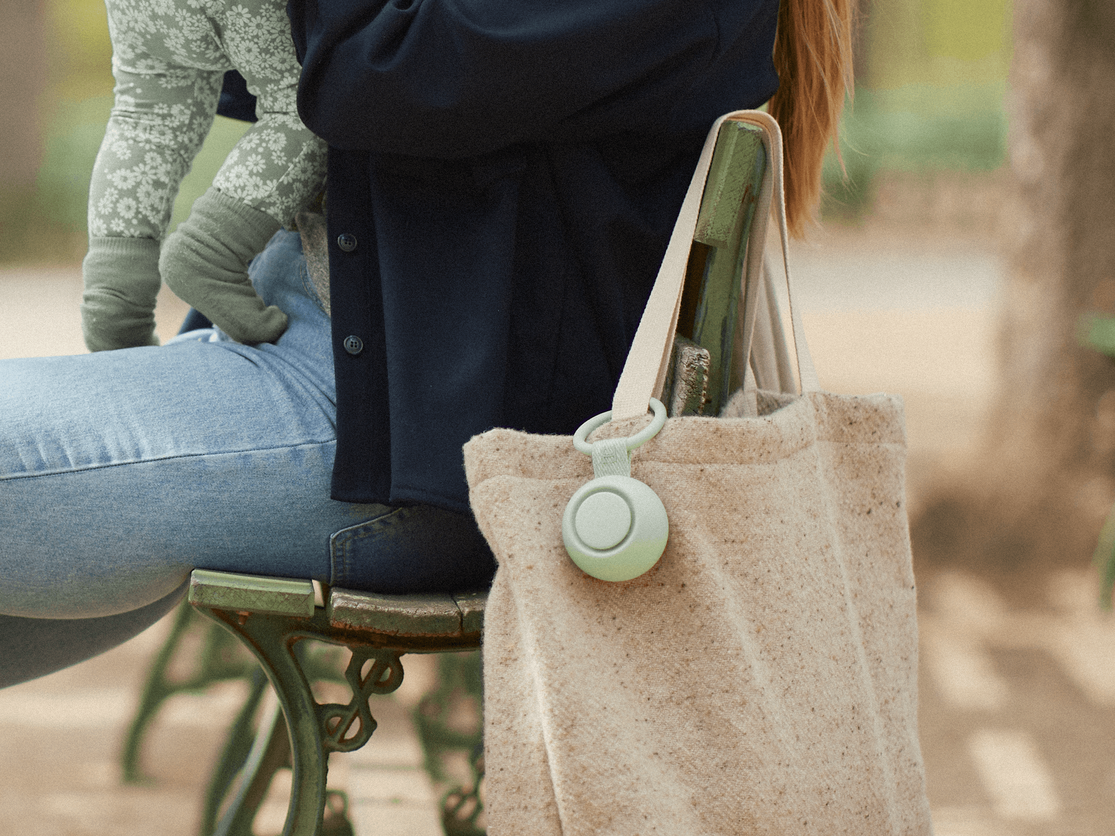 Hatch Go mint colorway hanging from a mother's tote bag