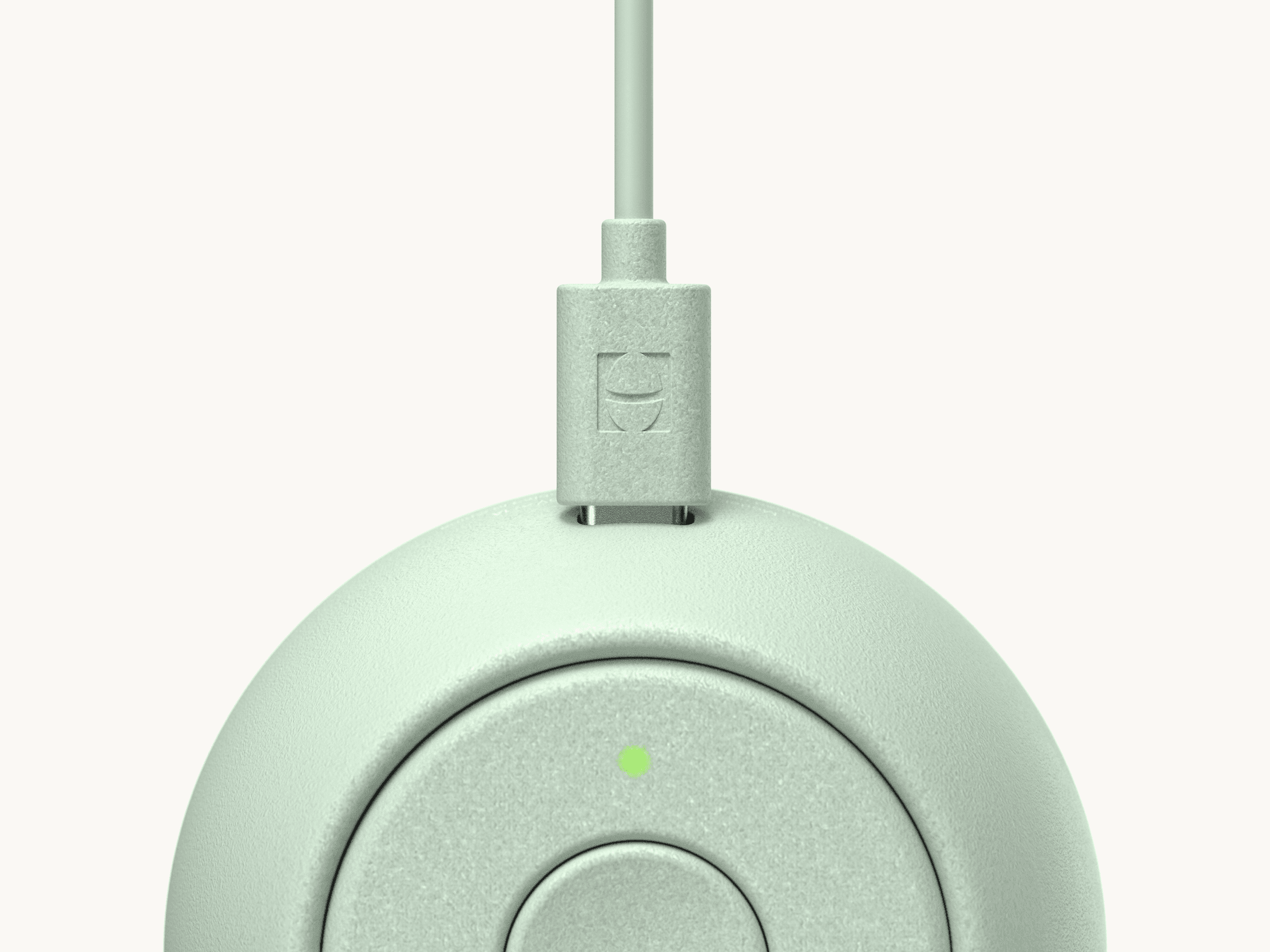 Hatch Go mint colorway with included charger plugged in